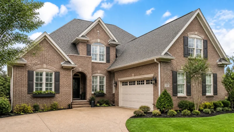 Brick house with a new shingle roof and attached garage